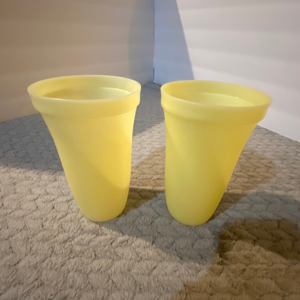 Cute pair of yellow Tupperware cups.